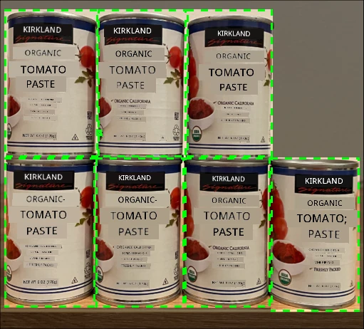 7 cans of tomato paste on a shelf, 4 on the top row, 3 on top