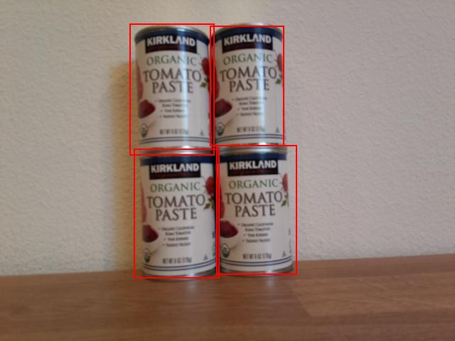 4 cans of tomato paste with bounding boxes around each can